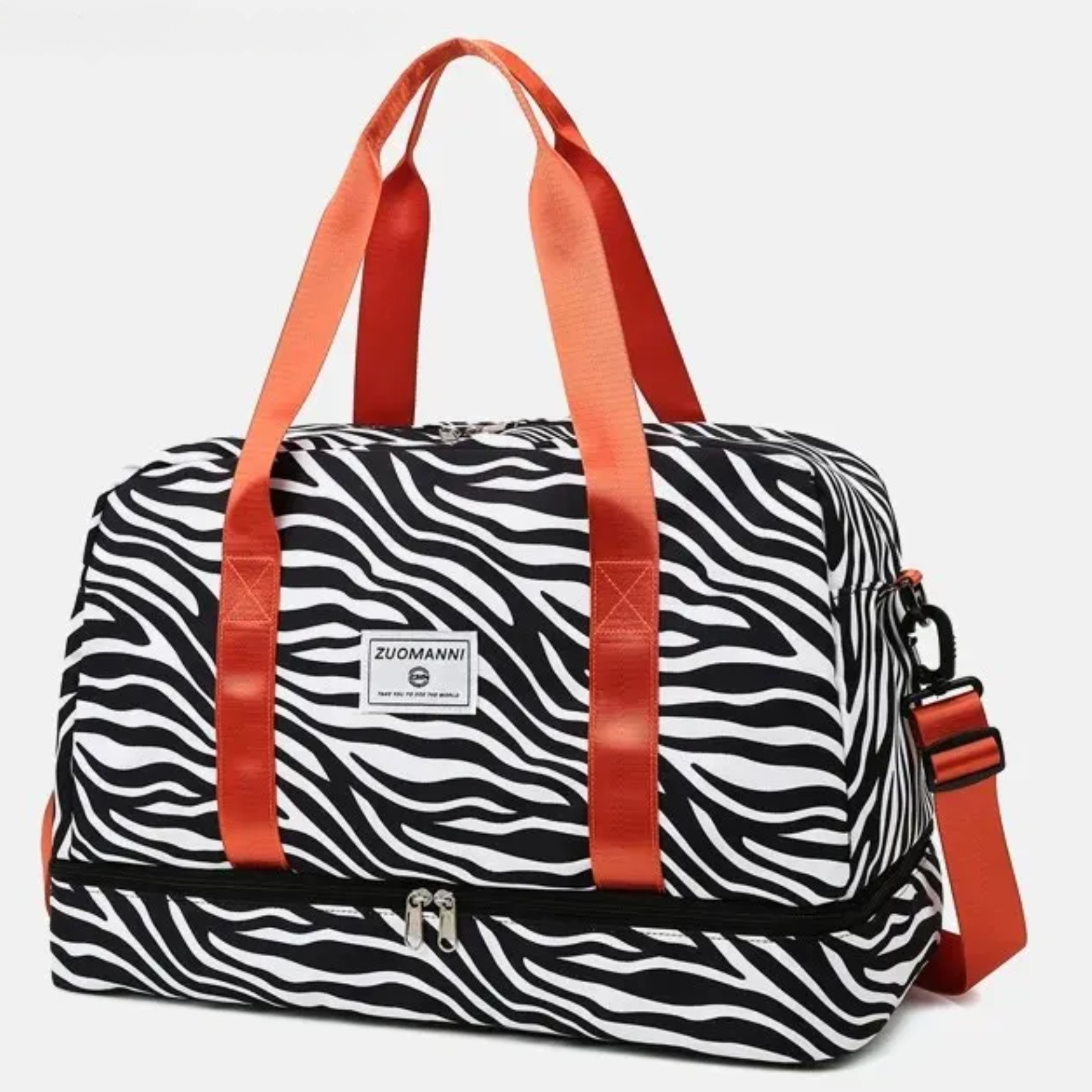 Bolsa de viagem feminina grande estampa zebra com alças vermelhas, ideal para finais de semana e viagens curtas.